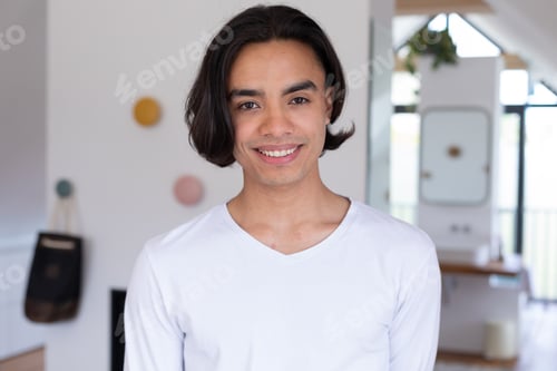 Preview: Portrait of happy biracial man looking at camera and smiling