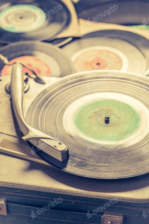 Preview: Retro gramophone and old black vinyl records.