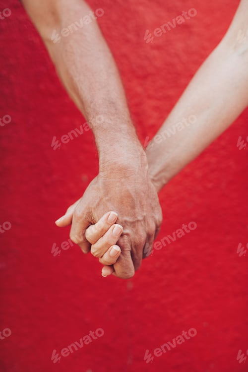 Preview: Loving man and woman holding hands