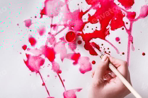 Preview: Vibrant Red Paint Splatters and Artist's Hand