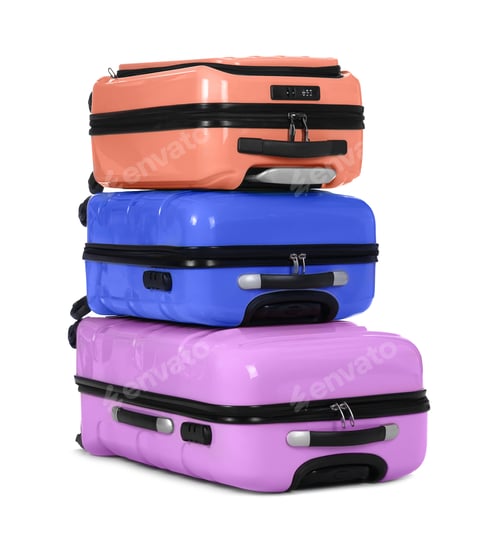 Preview: Stylish suitcases packed for travel on white background