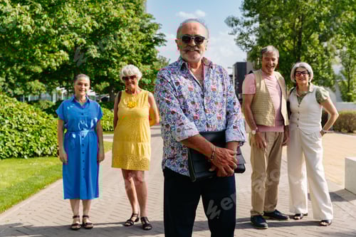 Preview: Group of senior friends meeting outddors in the city and having fun