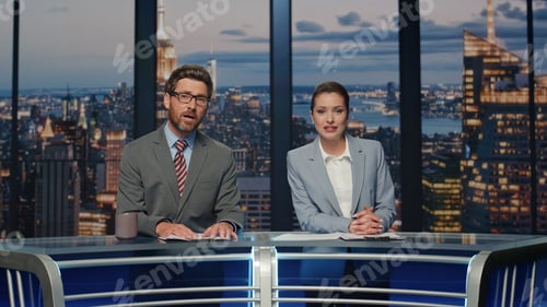 Preview: Presenters broadcasting breaking news late studio closeup. Smiling hosts talking