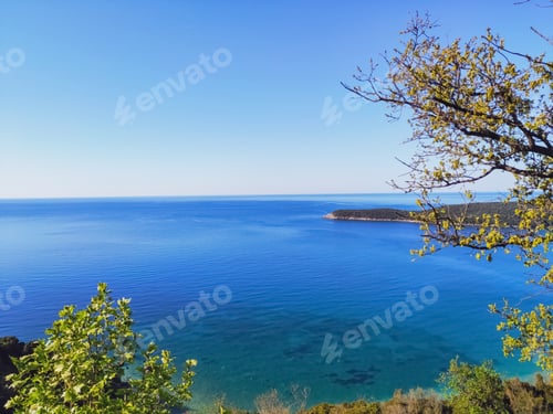 Preview: The blue Adriatic calm sea going over the horizon on a sunny warm day against a clear sky
