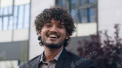 Preview: Portrait in city outdoors Indian man business specialist smiling toothy happy laughing businessman