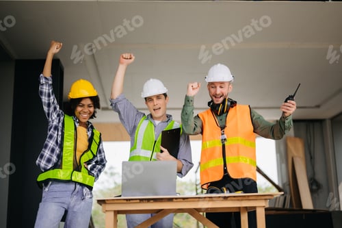 Preview: Engineer desk with object paper and tablet with blurry engineer teamwork hardworking