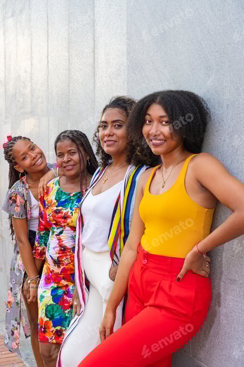 Preview: Diverse friends sharing a laugh with a gray wall backdrop