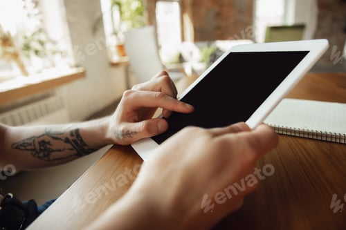 Preview: Close up of male hands using tablet with blank screen, copyspace, education and business concept
