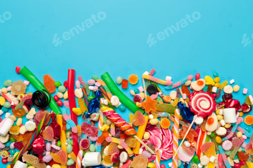 Preview: colored candies on blue background