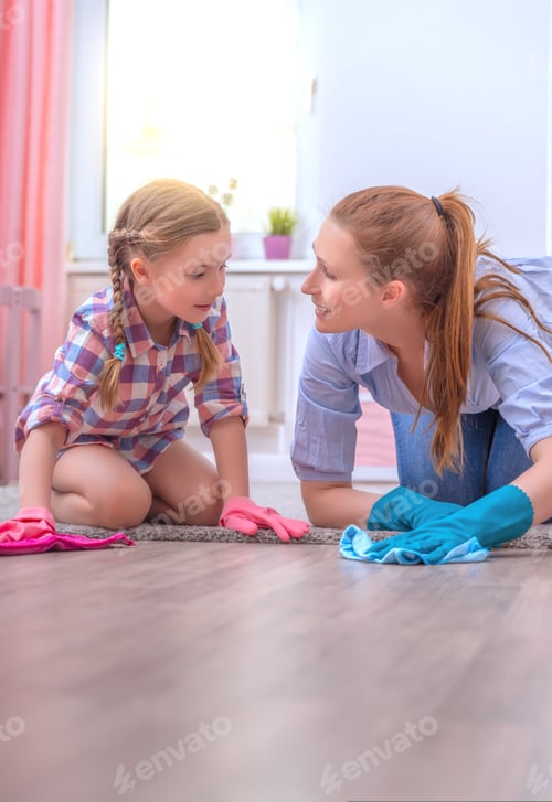 Preview: Woman and Child Cleaning Together at Home
