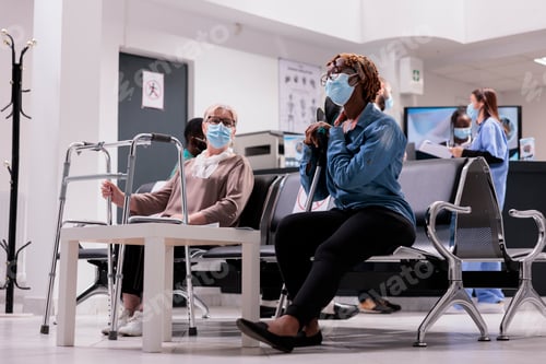 Preview: People Wearing Masks Sitting in Waiting Room