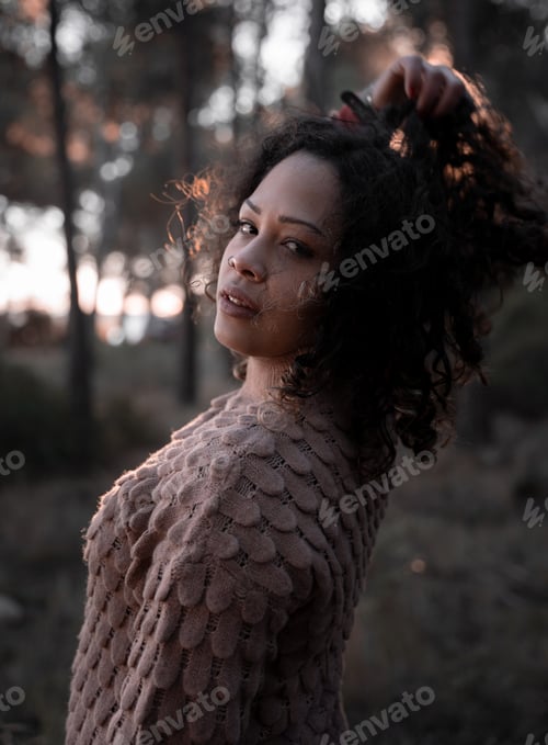 Preview: Black girl posing during sunset in the nature