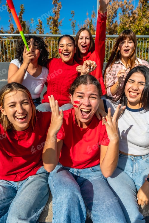 Preview: Young women friends celebrating sport event cheering