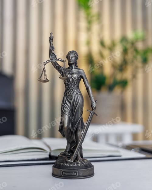 Preview: statuette of Themis, the goddess of justice, stands on a table in the office of a law firm or