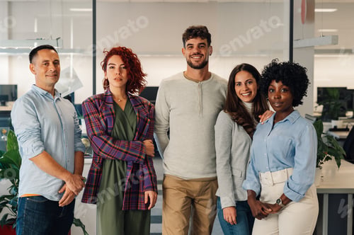 Preview: Portrait of a dedicated multicultural team posing at office.
