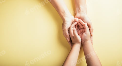 Preview: Top view of family hands stacked isolated background. Parents and kid hold empty space a gesture of