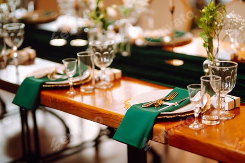 Preview: Banquet table in the restaurant, preparation before the banquet. The work of professional florists.