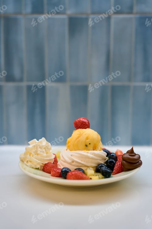Preview: Delicious pavlova cake with exotic fruits, ice cream and whipped cream topping