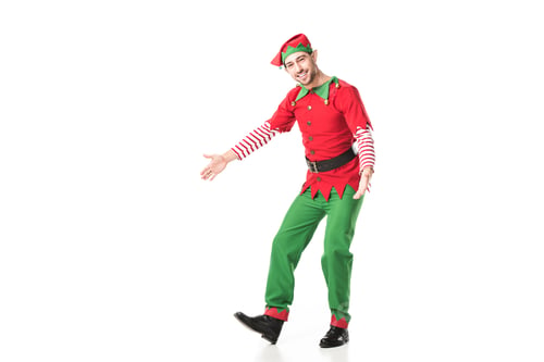 Preview: happy man in christmas elf costume with outstreched hands isolated on white