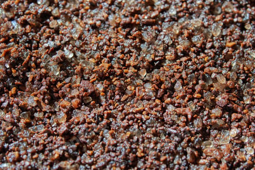 Preview: Close up of coarse brown sugar and coffee granules blended together in a texture