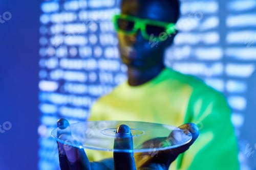 Preview: Young black in trendy sunglasses showing transparent optical disc