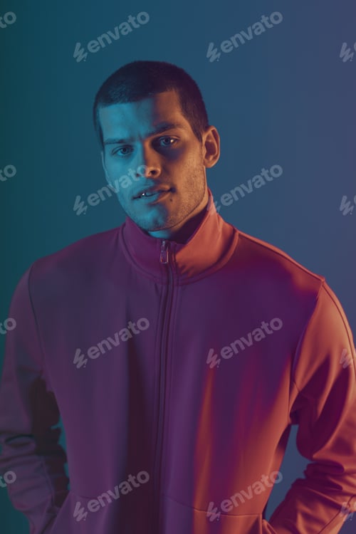 Preview: Studio close-up portrait of attractive male model. Color flash studio light