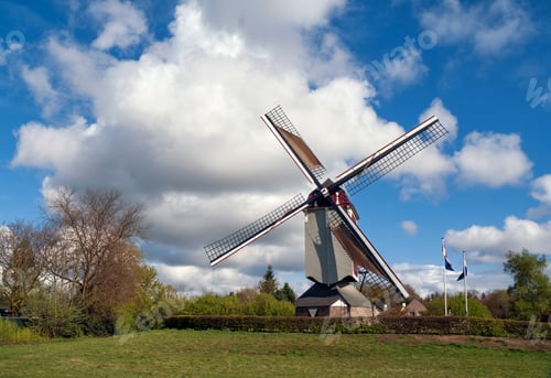 Preview: White clouds and blue sky above the Oostenwind windmill