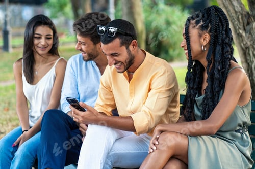 Preview: Young Friends Socializing in Park - Technology and Leisure