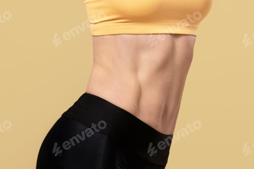 Preview: Attractive adult lady in sportswear with fitness tracker raises her hands behind her head