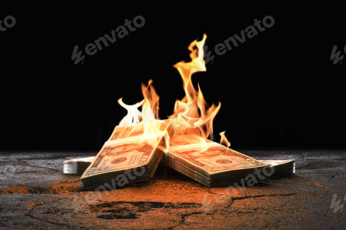 Preview: Closeup heap of Dollar bills burning with orange fire against black background