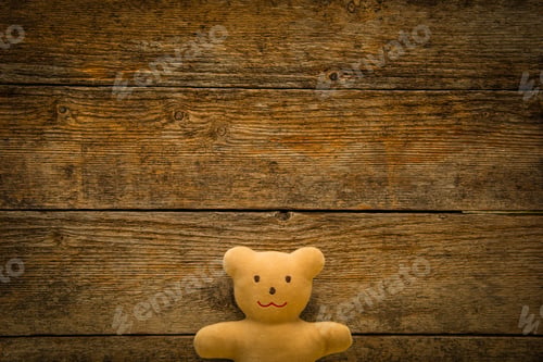Preview: Adorable teddy bear on toned wooden background. Space for text