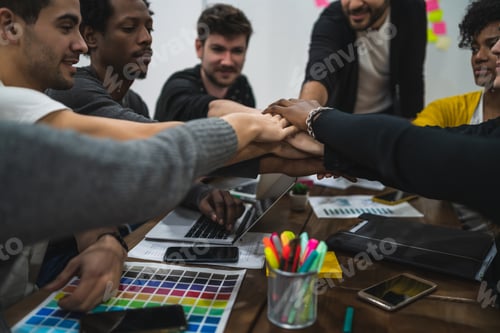 Preview: Team of work showing unity with their hand together.