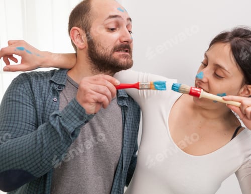 Preview: Couple playing with paint brushes