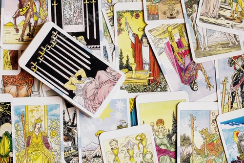 Preview: Assorted tarot cards scattered on a table, seamless pattern
