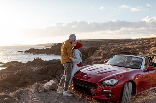 Preview: Lovely couple traveling by car near the ocean