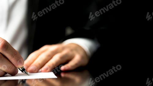 Preview: Professional at Work Writes on Paper