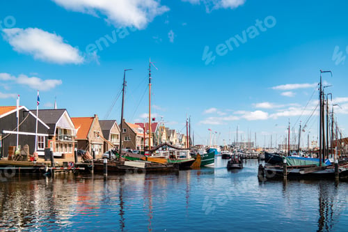Preview: Urk Flevoland Netherlands sunset at the lighthouse and harbor of Urk Holland