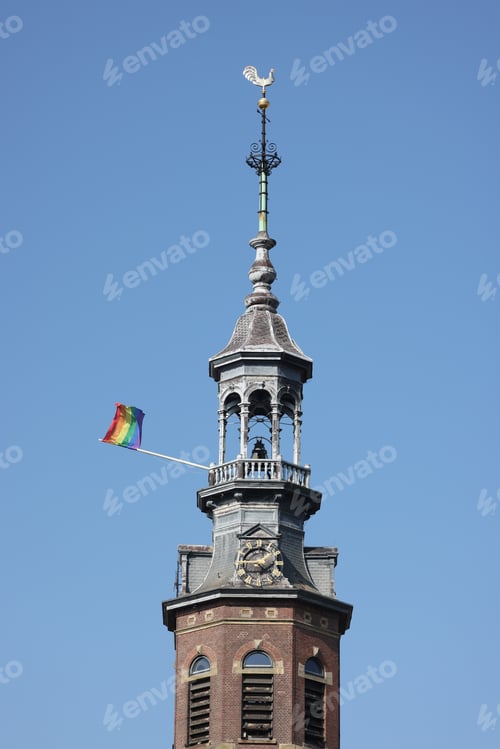 Aperçu: Rainbow flag on a church bell tower in Amsterdam, Holland