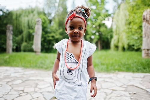 Preview: Close up portrait of african baby girl walking at park