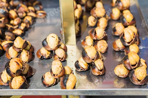 Preview: grilled chestnuts for sale on the street. Street fast food.