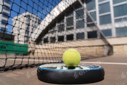 Preview: Padel ball under racket on court