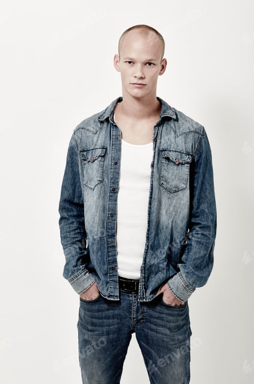 Preview: Fan of denim. Studio portrait of a handsome young male model.