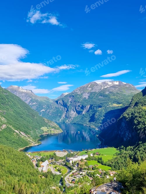 Preview: Breathtaking fjord landscape with mountains and vibrant greenery under a clear blue sky