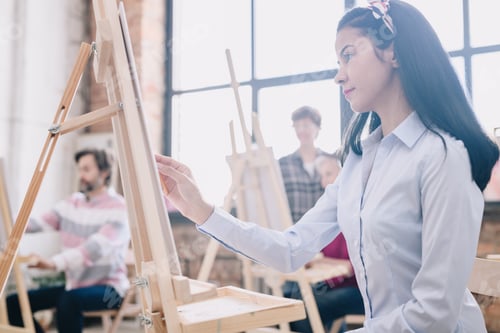Preview: Young Woman Painting in art Studio