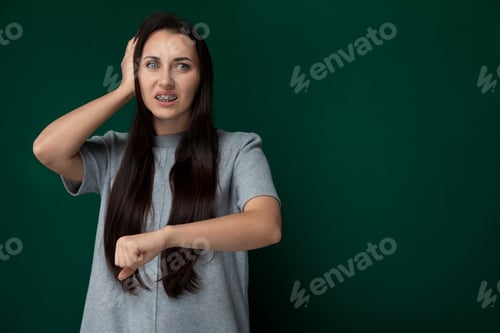 Preview: Worried Woman Holding Head in Hands