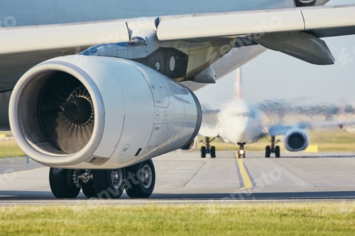 Preview: Hot air from jet engine against airplane taxiing to airport runway.
