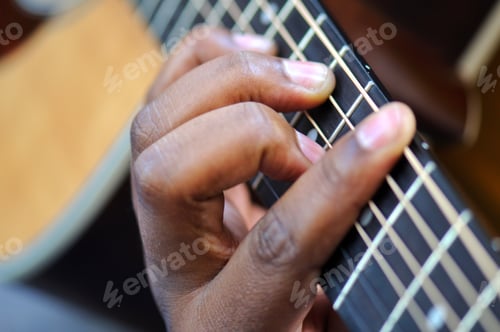 Preview: Male black musician plays his acoustic guitar