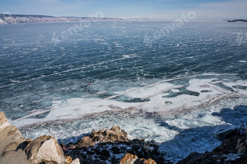Preview: scenic view of frozen river with snowy mountains in winter, Russia, Lake Baikal, march 2016