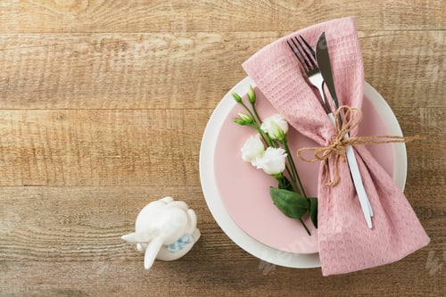 Preview: Easter brunch table setting. Spring Easter holiday concept with white, pink plate and napkin with de