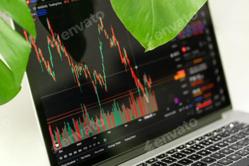 Preview: Trading chart displayed on the screen of the laptop. Stock market, trend line in a candlestick form.